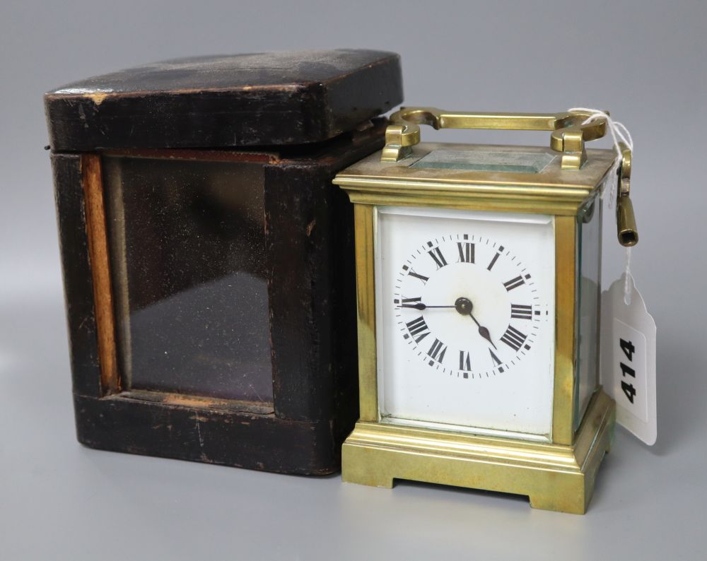A French brass carriage timepiece with outer carrying case